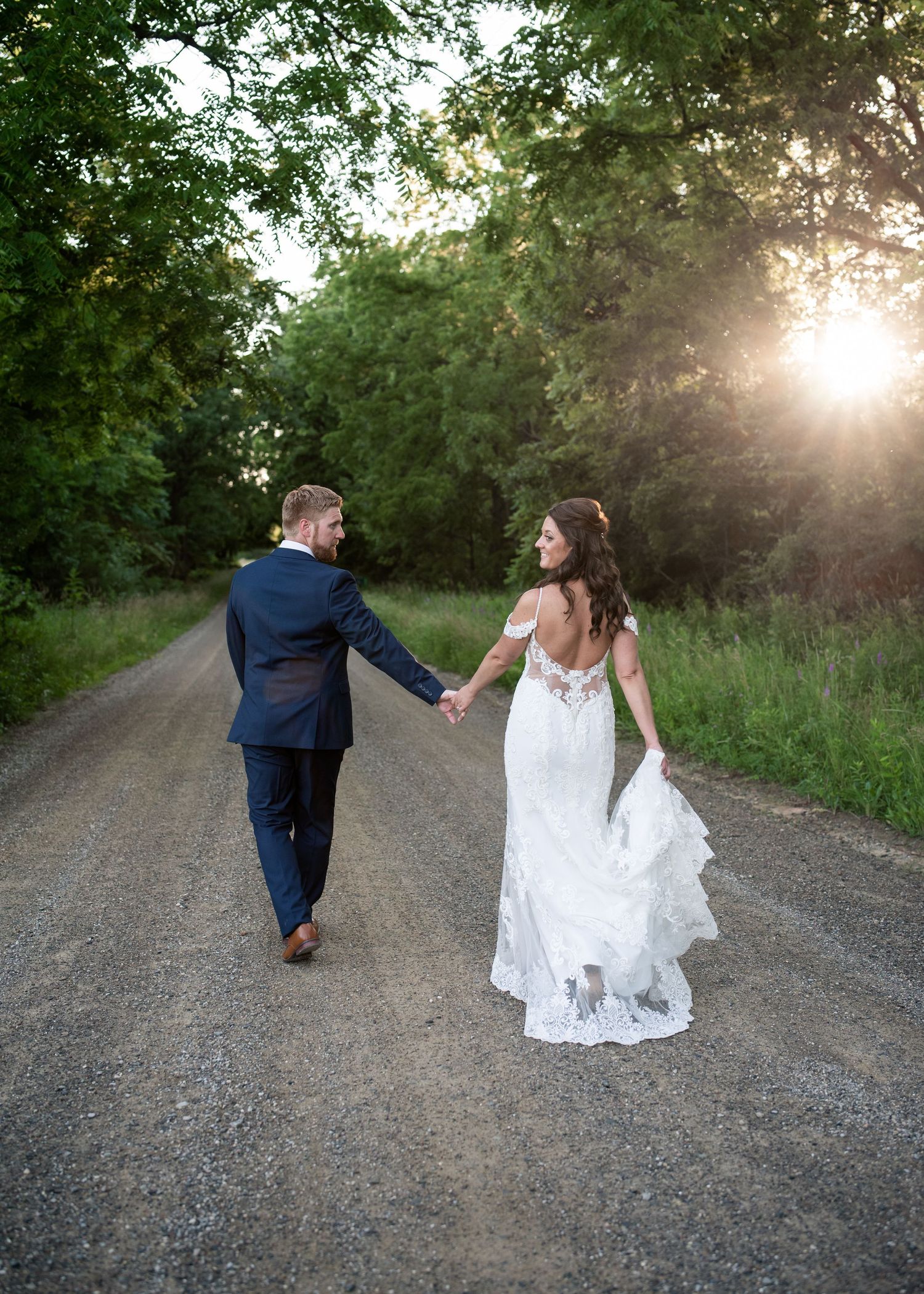 Bride and groom sharing a moment under the gazebo during wedding portrait session, natural and romantic.