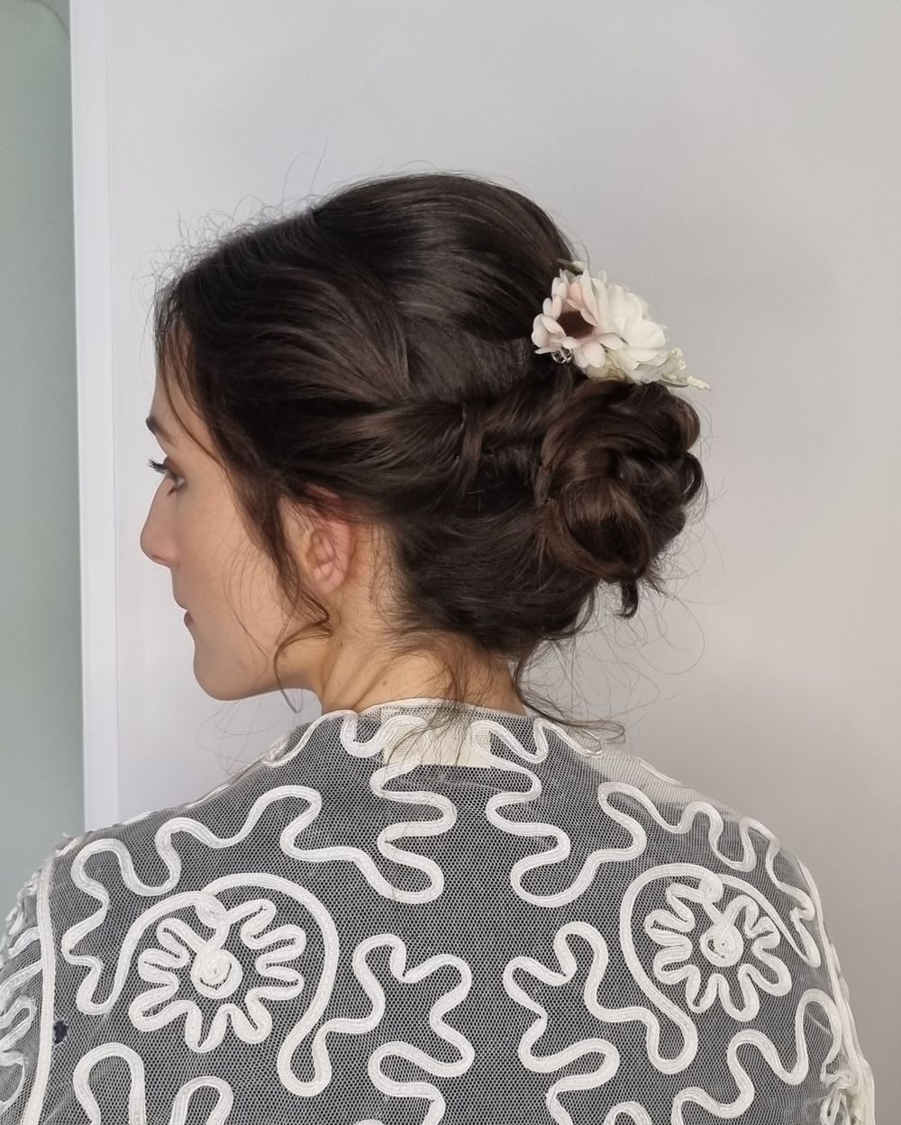 Classic chignon with flower embellishment