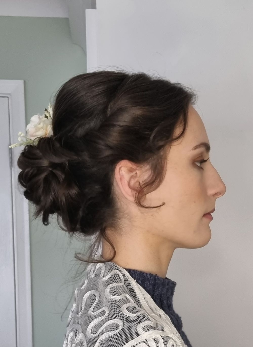Classic low chignon bun with flowers