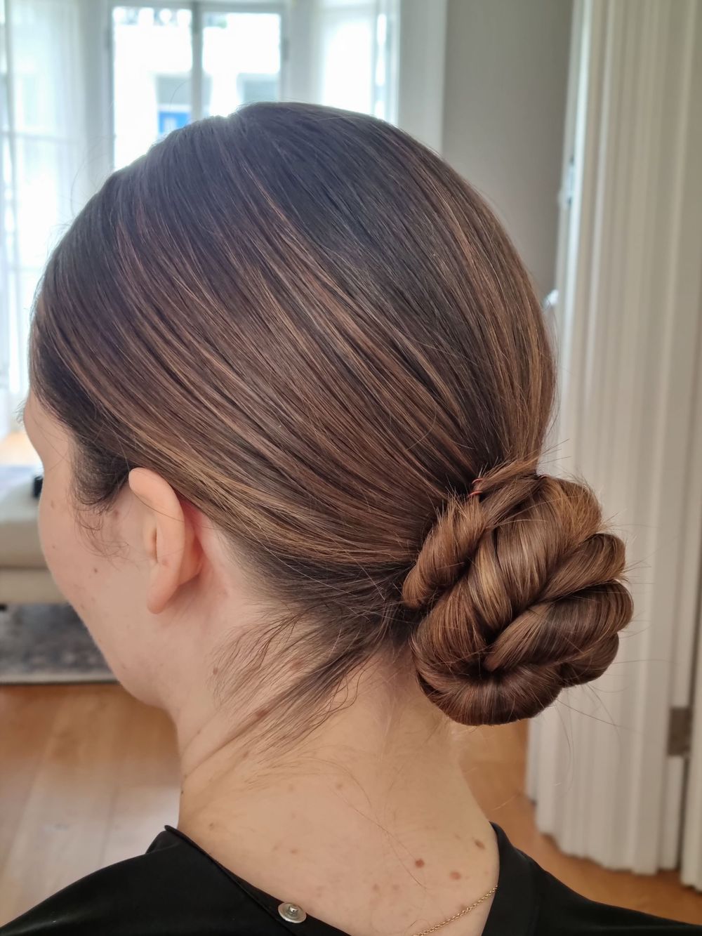 Small, twist wrapped low bun
