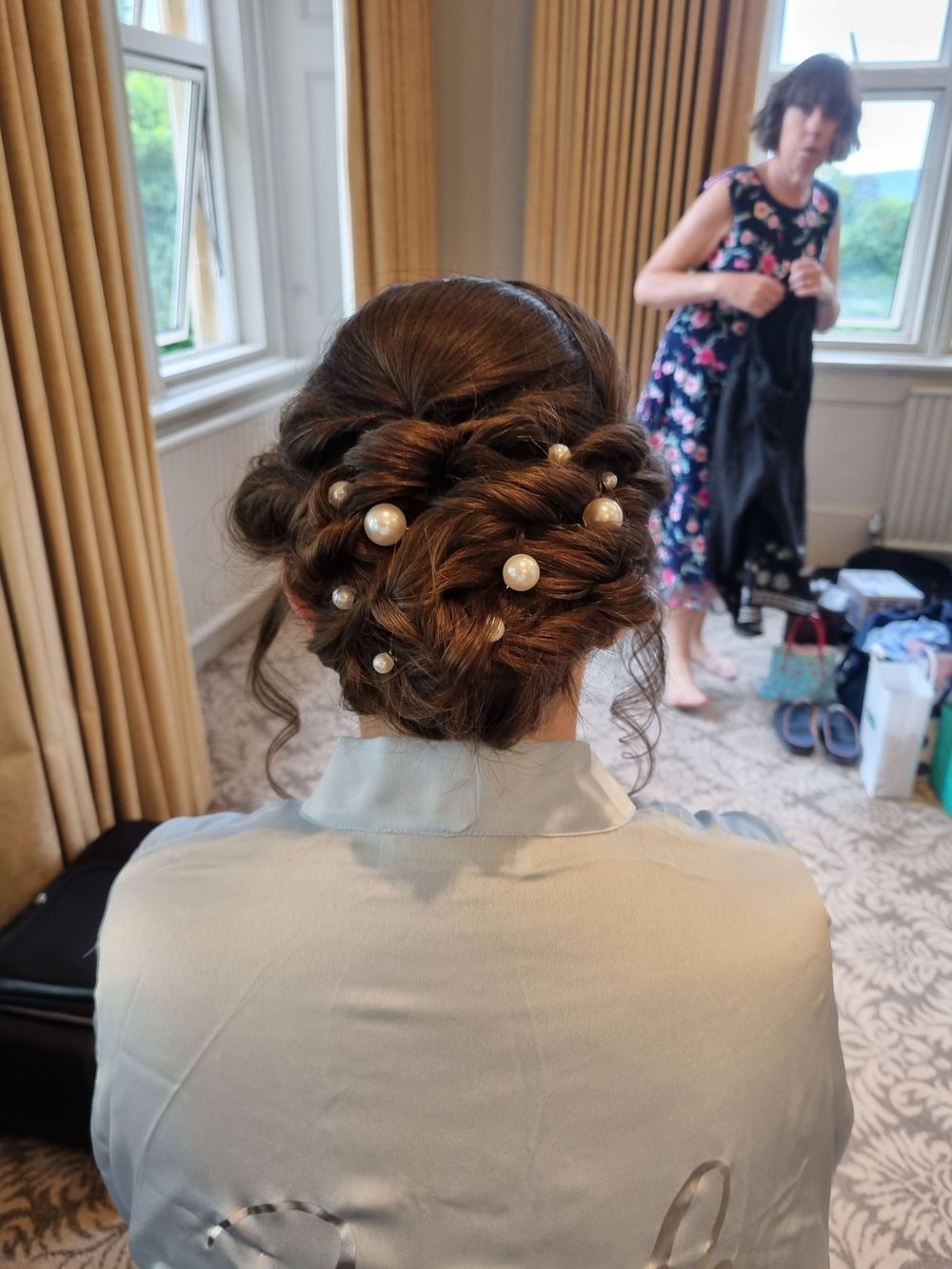 Twisted back hair forming low chignon