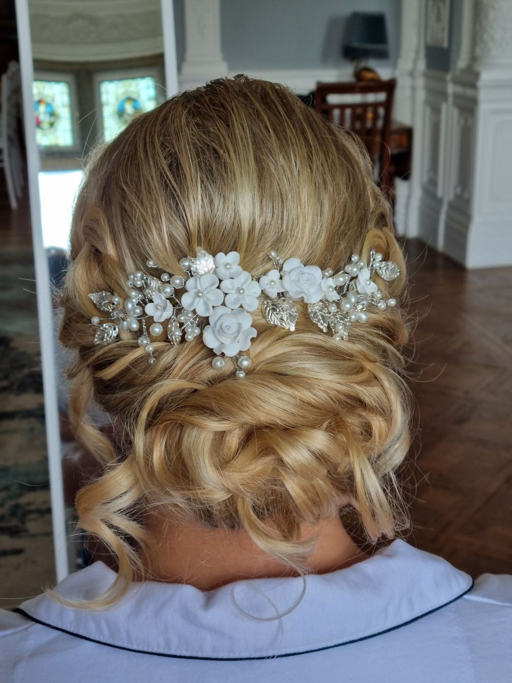 Low messy bun with loose curls