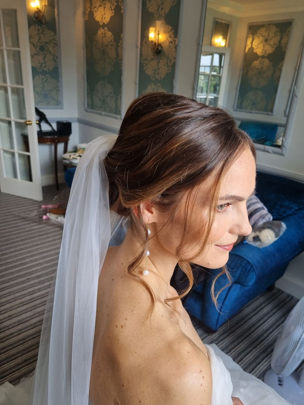 Swept back hair. low bun and lots of tendrils