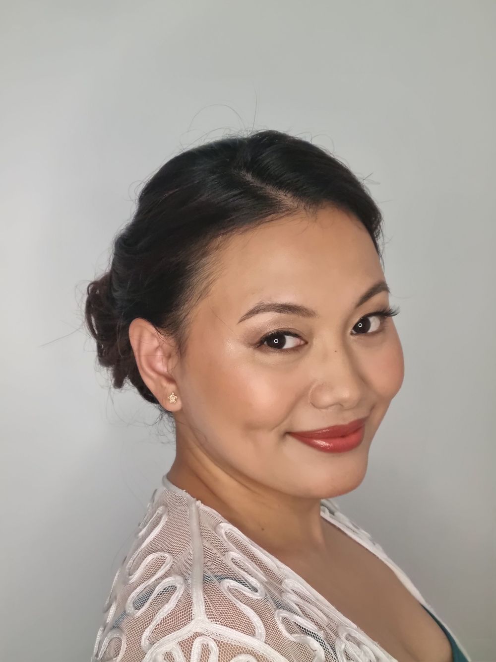 Neat, swept back hair and low bun
