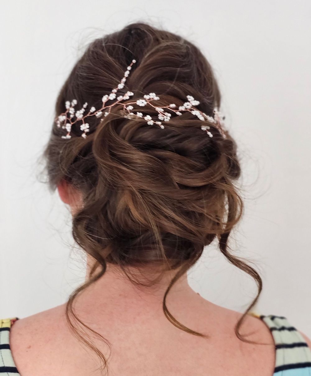Low bun and tendrils