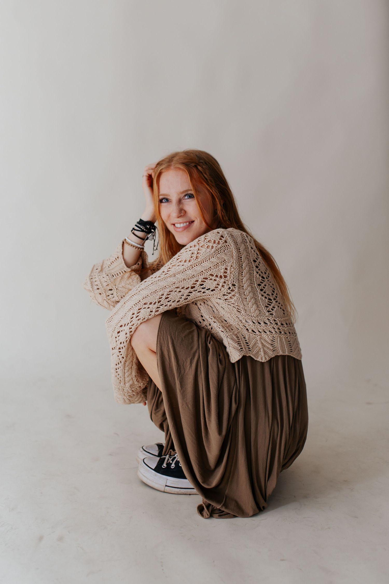 Alea taking branding photos in a studio background