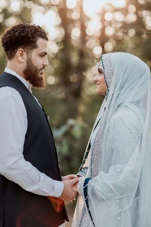 A sequence of intimate wedding photos showing a couple in their wedding attire reading vows in soft golden light.