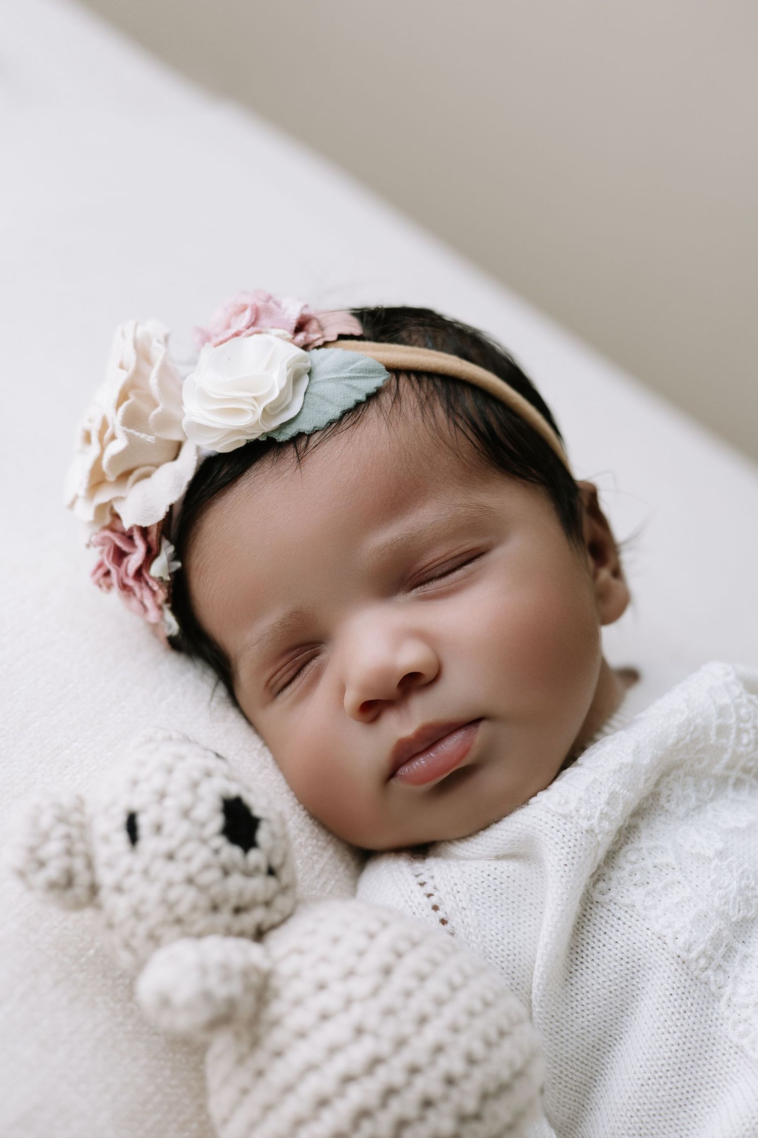 Intimate newborn portrait in Cap Cana with gentle tones and natural style, highlighting baby’s first days in a calm setting.