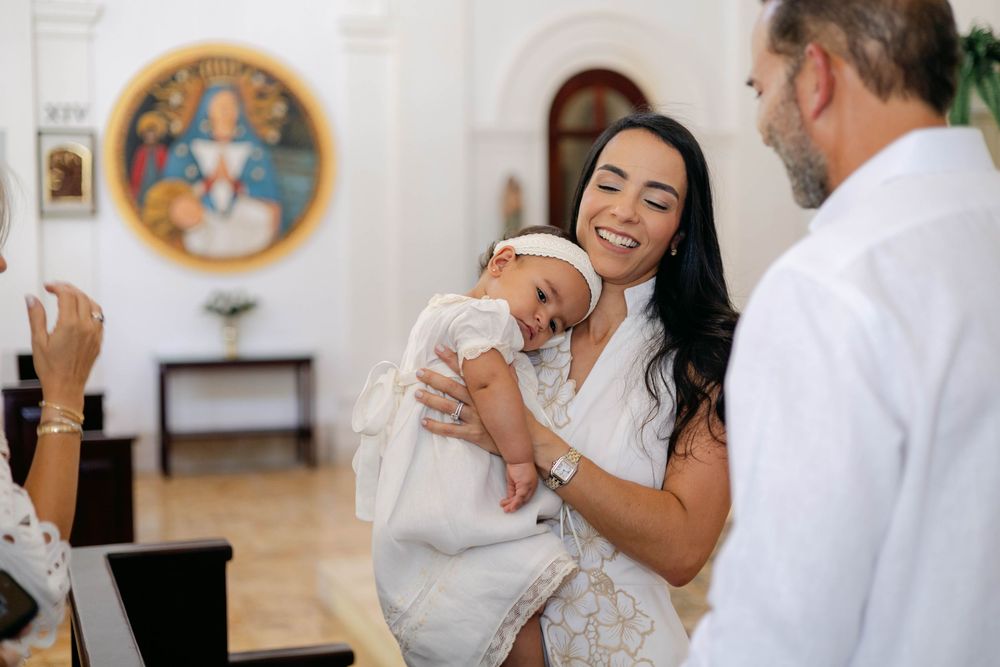 Christening session in Cap Cana with soft lighting and sophisticated backdrop. Beautiful storytelling of a special spiritual milestone.