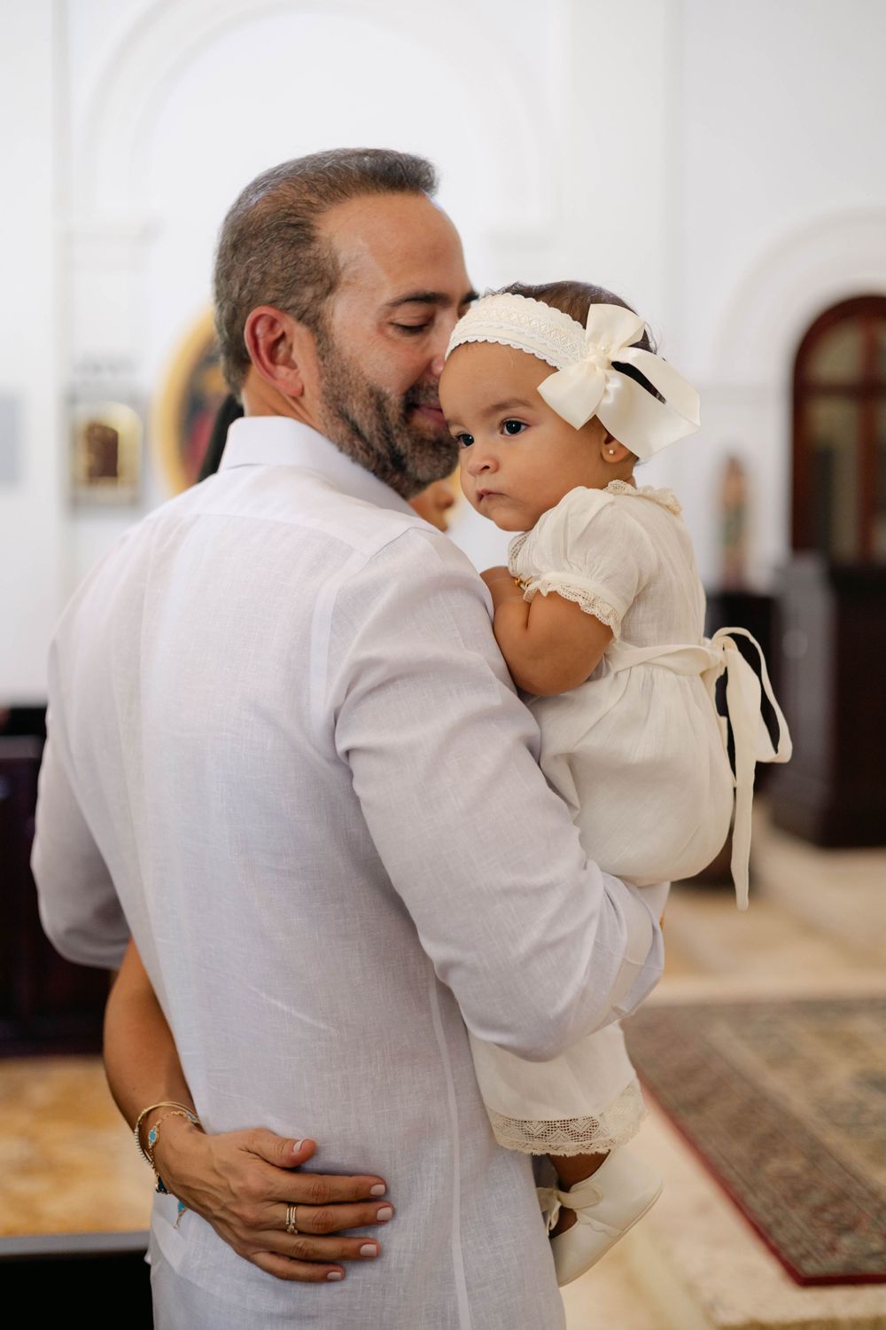 Christening photography in Punta Cana combining candid moments and styled portraits. Bright, airy images full of warmth and meaning.