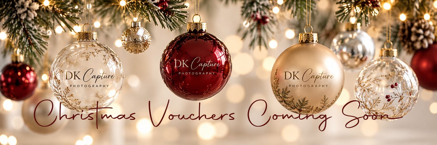 Festive Christmas ornaments in gold and red with DK Capture Photography branding and Christmas Vouchers Coming Soon text.