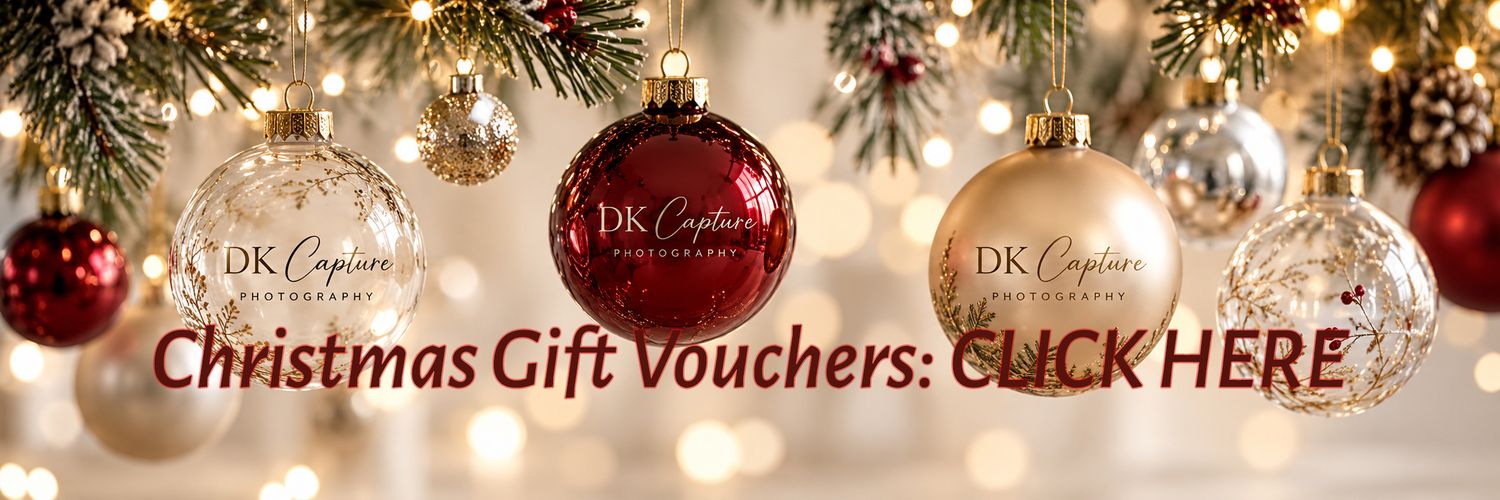 Festive Christmas ornaments in gold and red with DK Capture Photography branding and Christmas Vouchers Coming Soon text.
