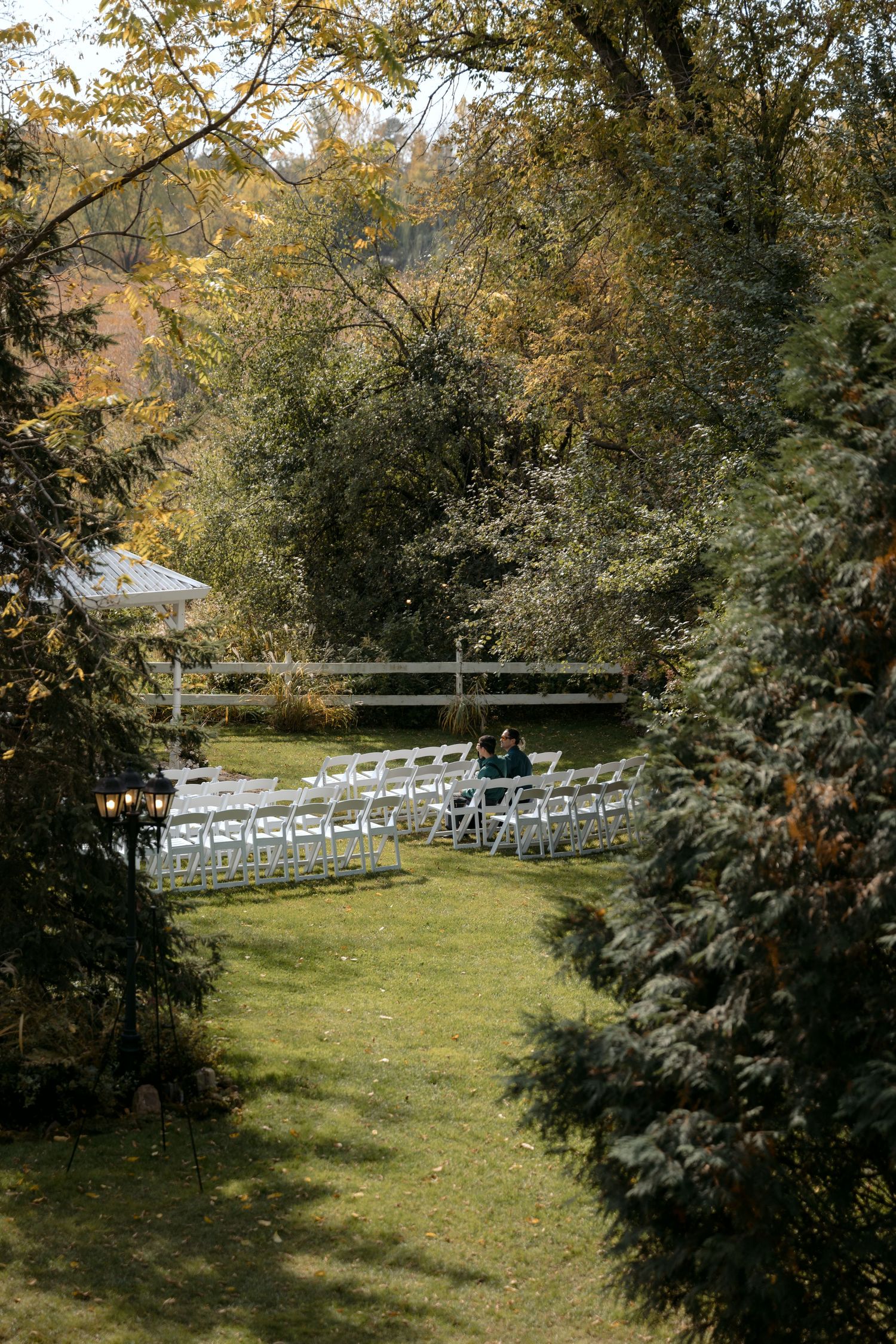 Guests wait for the ceremony to begin at the garden inspired Trellis Wedding Venue in Stillwater MN.