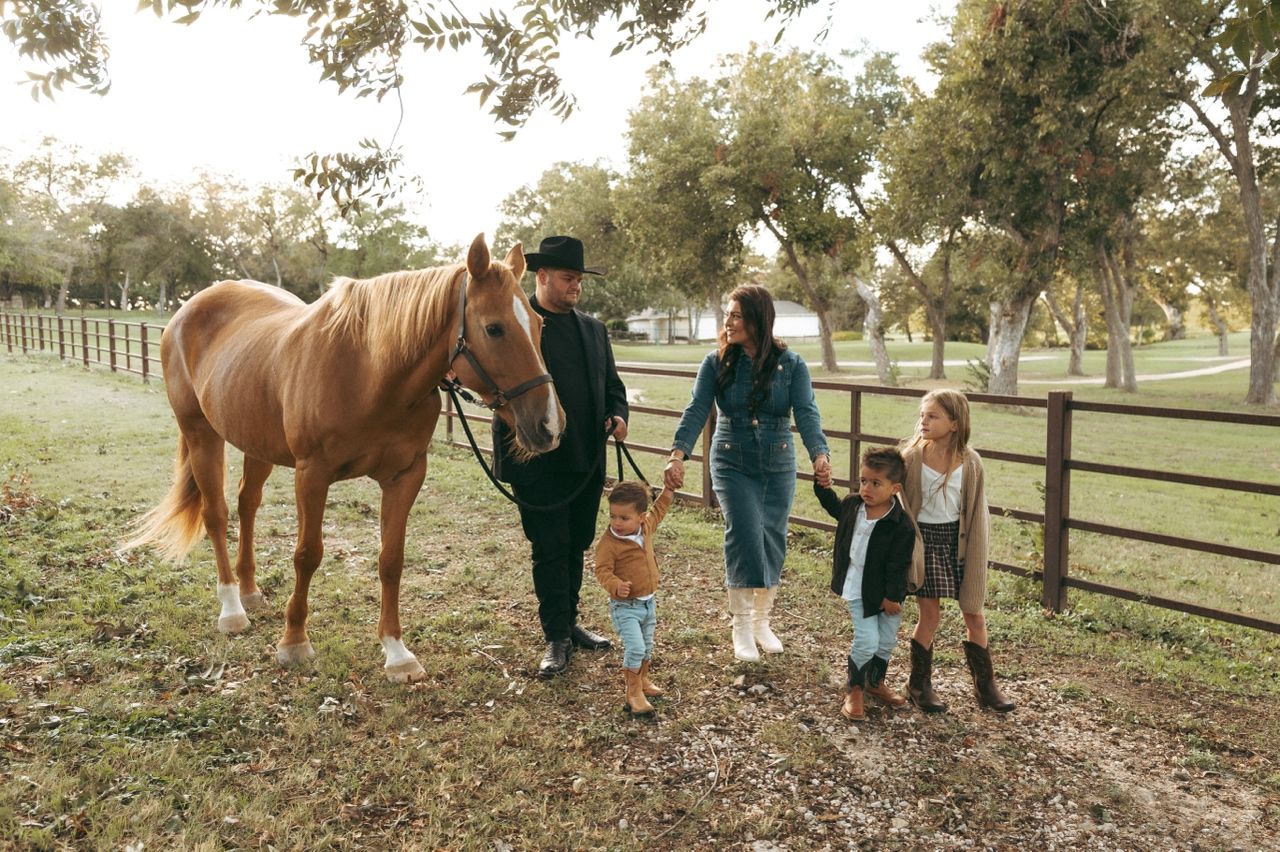 Western-style family portraits with a horse at Windmill Stables in Richardson, Texas.