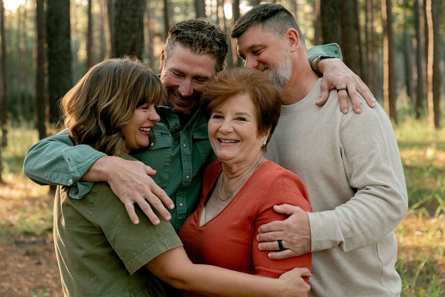 Grandmother posing with her adult children during a Conroe family photography session.