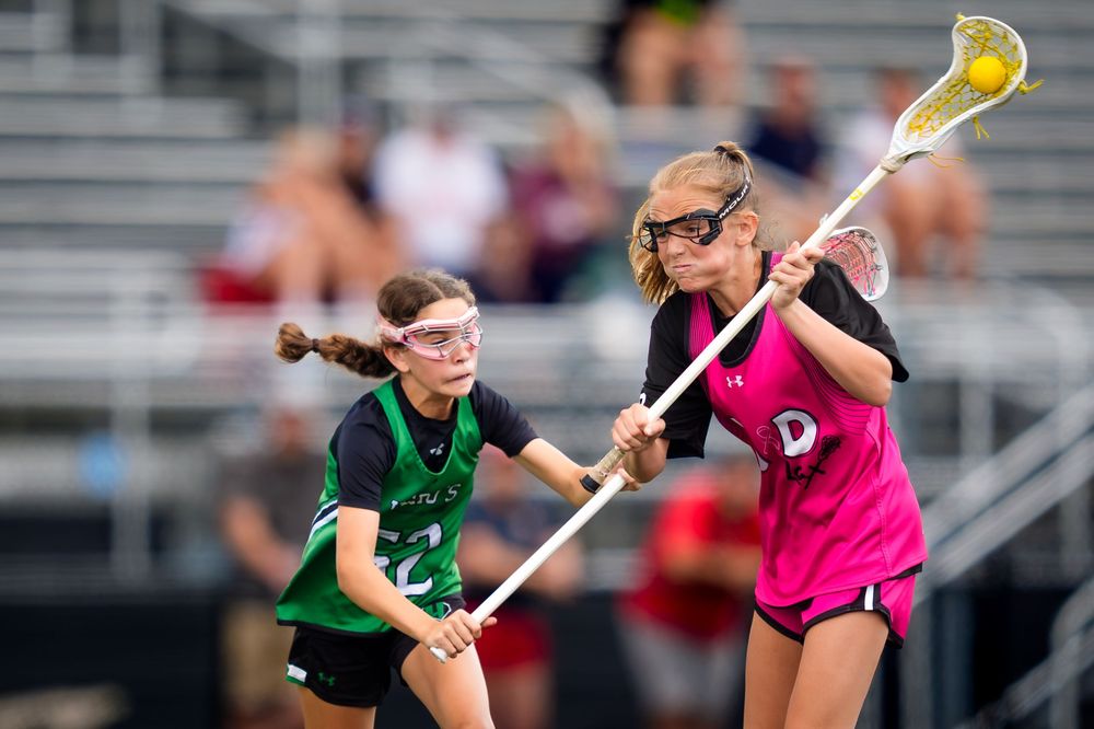 M&D Black 2031 and Heros battle for the ball in the lacrosse championship game, by Deanna Fox, SportsFox Photography based in Hershey PA