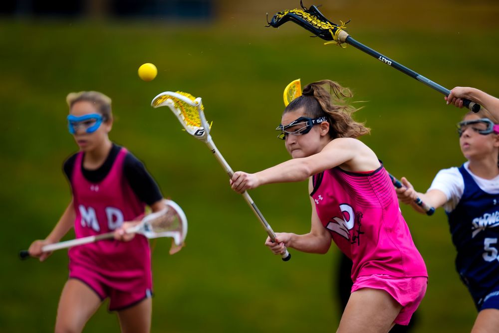 M&D Black 2031 defends a ground ball vs Sky Walker Blue at Summer Genesis Origins, by Deanna Fox, SportsFox Photography based in Hershey PA