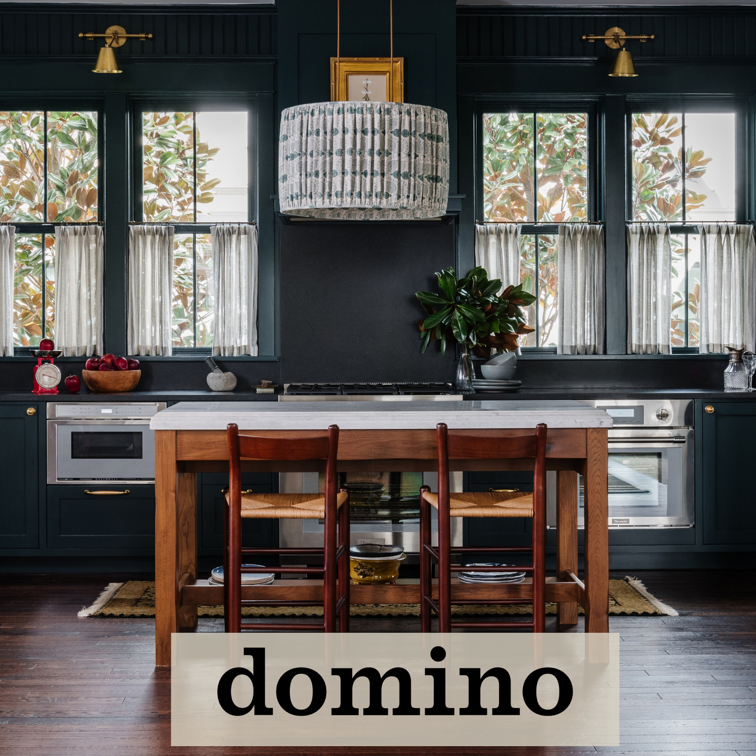 Dark and moody kitchen with wood base island