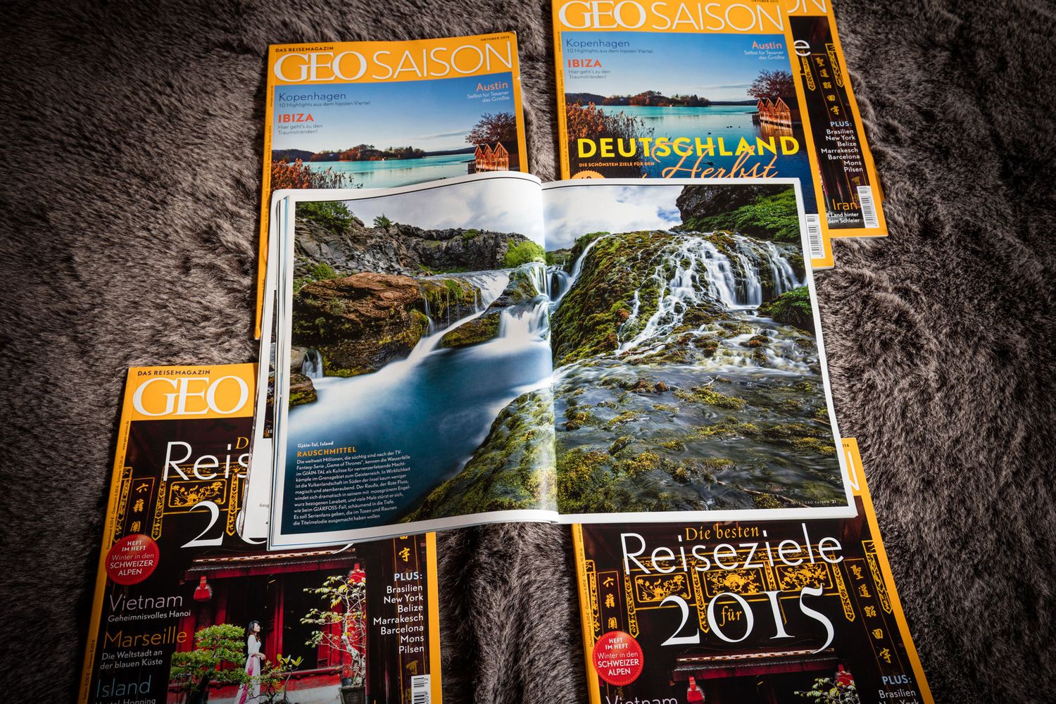 GEO Saison travel magazines spread open showing Deutschland feature and Reiseziele 2015 top destinations issue.