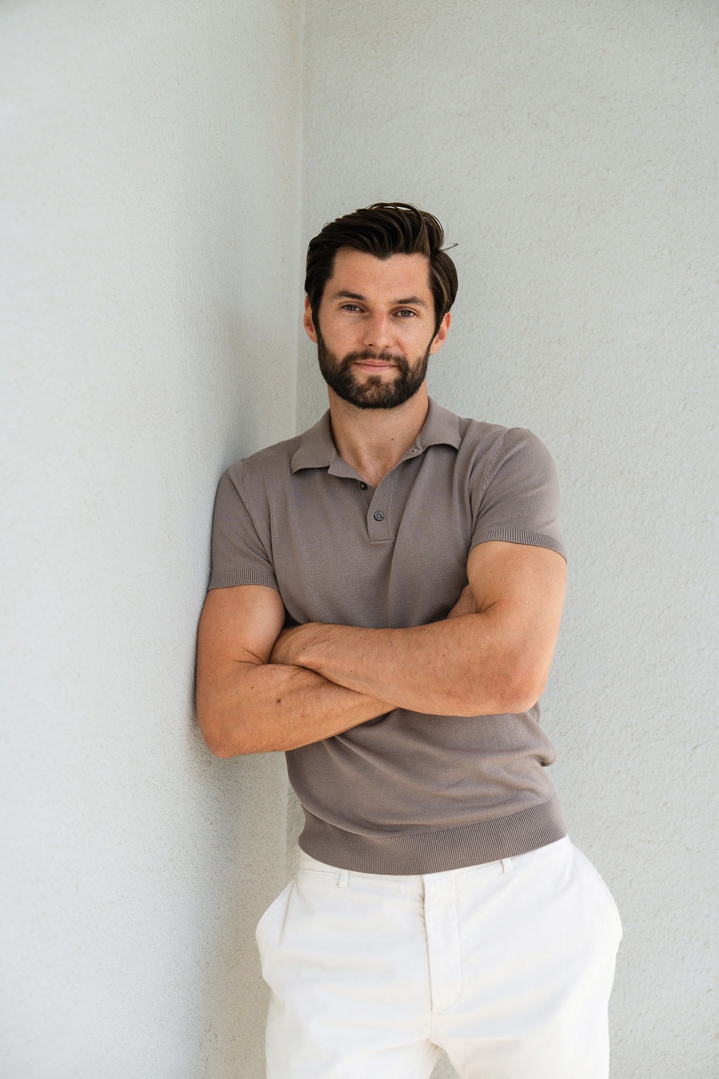 Professional portrait of entrepreneur against minimalist backdrop