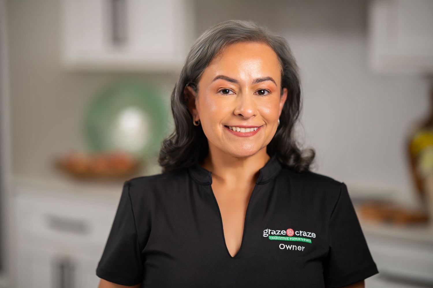 Orlando personal branding photographer Ray Alvarez — Graze Craze Orlando franchise owner headshot in black branded uniform
