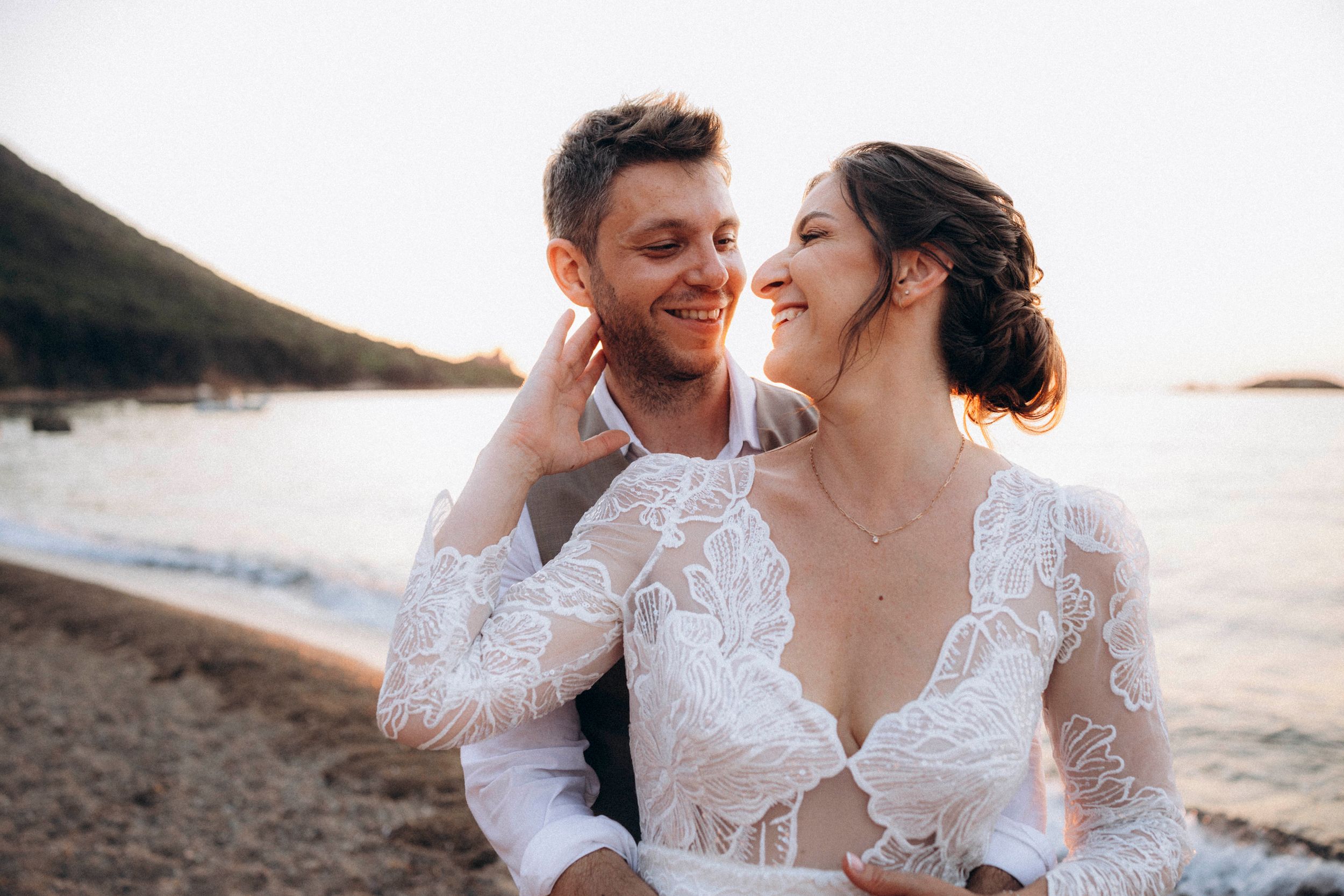 A romantic dance silhouette under stone archways with warm lighting.