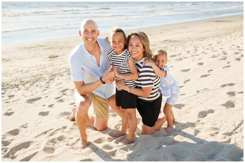 Parents hugging their children during a Punta Mita family photography session.