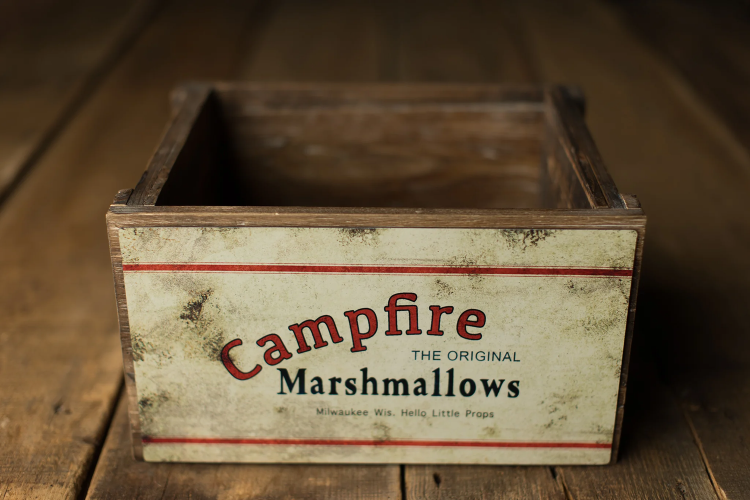 Vintage Campfire Marshmallows wooden crate box on rustic wood background.