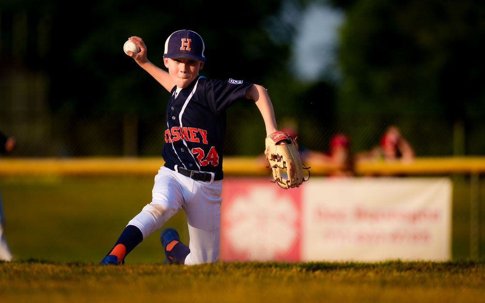 Hershey 11U Blue player follows throughduring the District 6 Championship game against Hampden, by Deanna Fox, SportsFox Photog