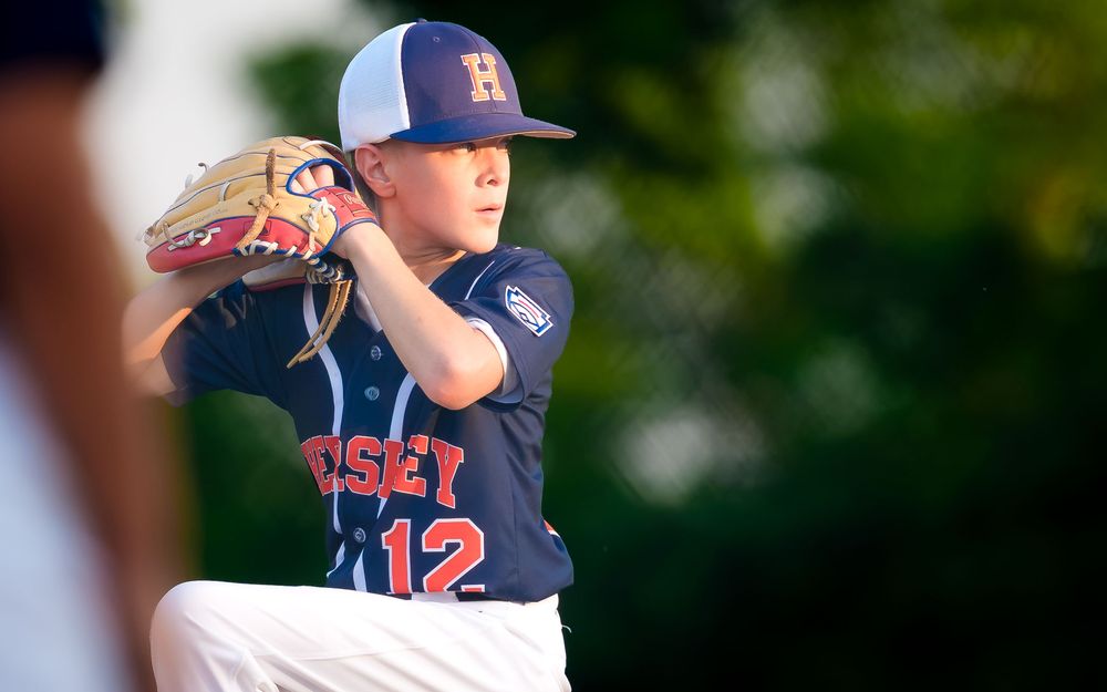 Hershey 11U Blue pitcher winds up to throw during the District 6 Championship game against Hampden, by Deanna Fox, SportsFox Photography, He