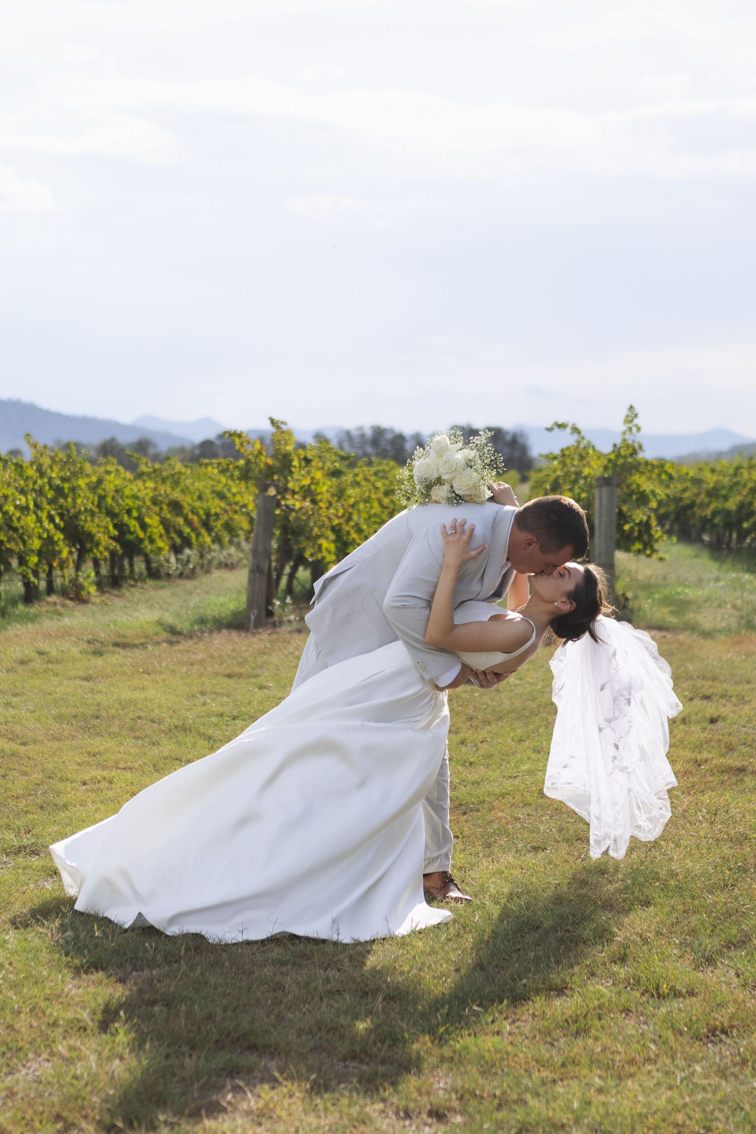 Bride and groom kissing at Two Rivers Winery Wedding in Denman