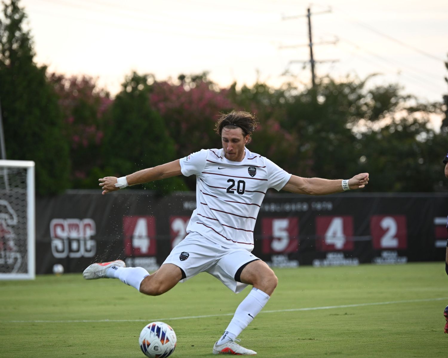 South Carolina soccer player wearing number 20 strikes the ball during a match.