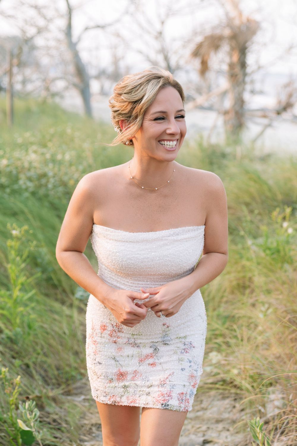 Rachel smiles during her beach engagement portrait session on Jekyll Island, Georgia