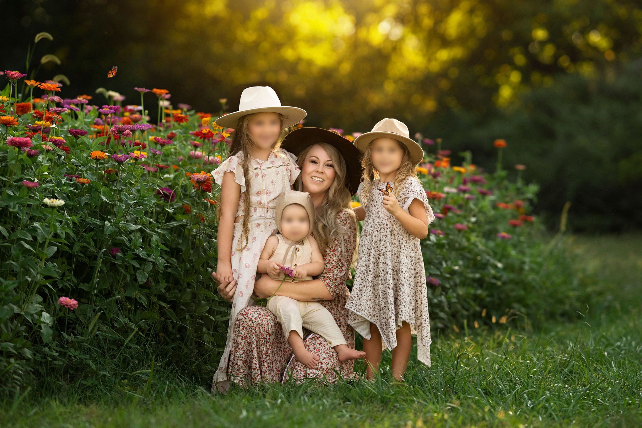 Mother and children in flowing floral dresses and neutral hats during a Middle Tennessee golden-hour session.