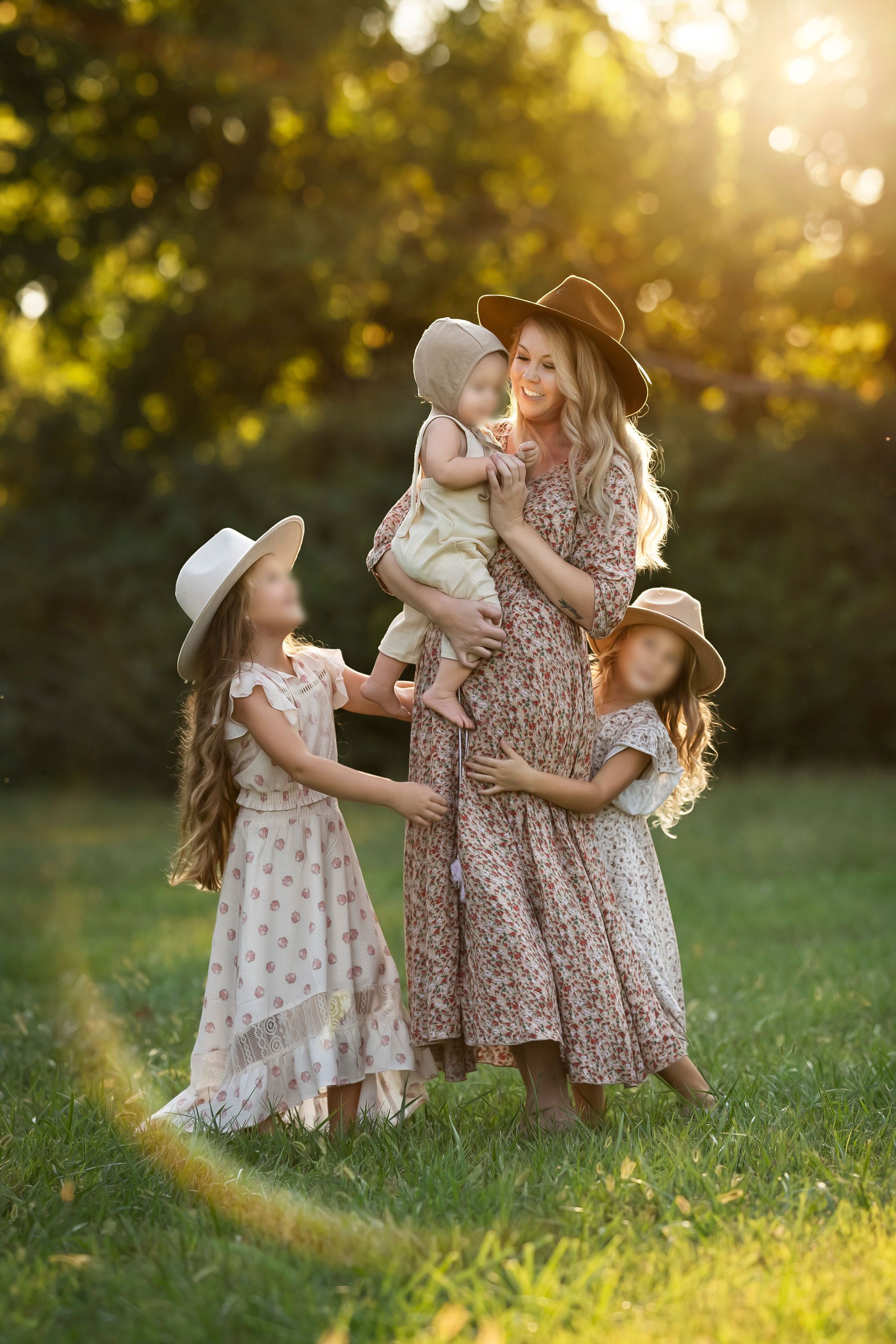 Mom and children in flowing floral dresses and neutral hats during a Middle Tennessee golden-hour session.