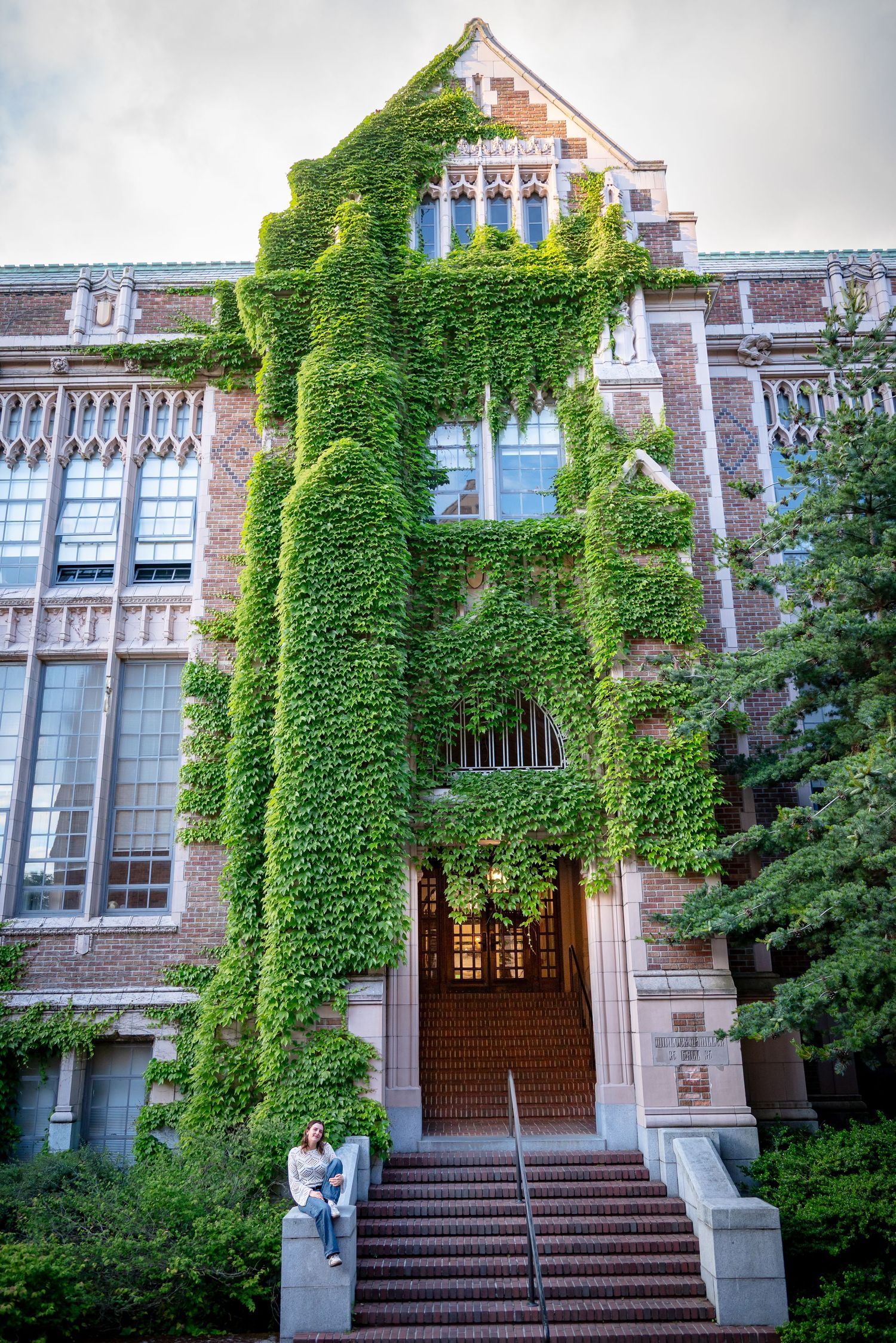 Graduation photo at the ivy-covered Miller Hall on the University of Washington campus