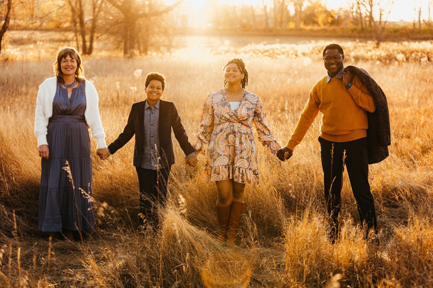 family standing in grass