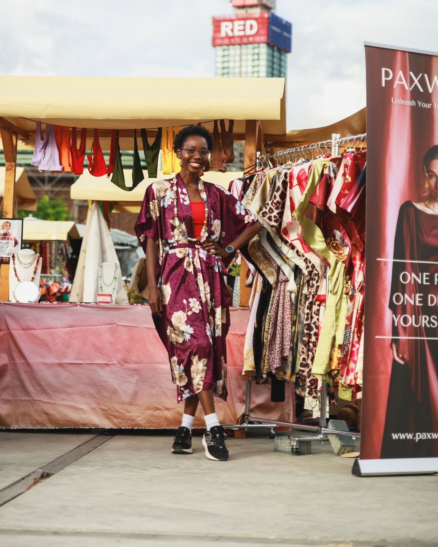 Paxware stand owner posing during event coverage of African Food Festival 2026 by Netherlands photographer CKA Visuals.