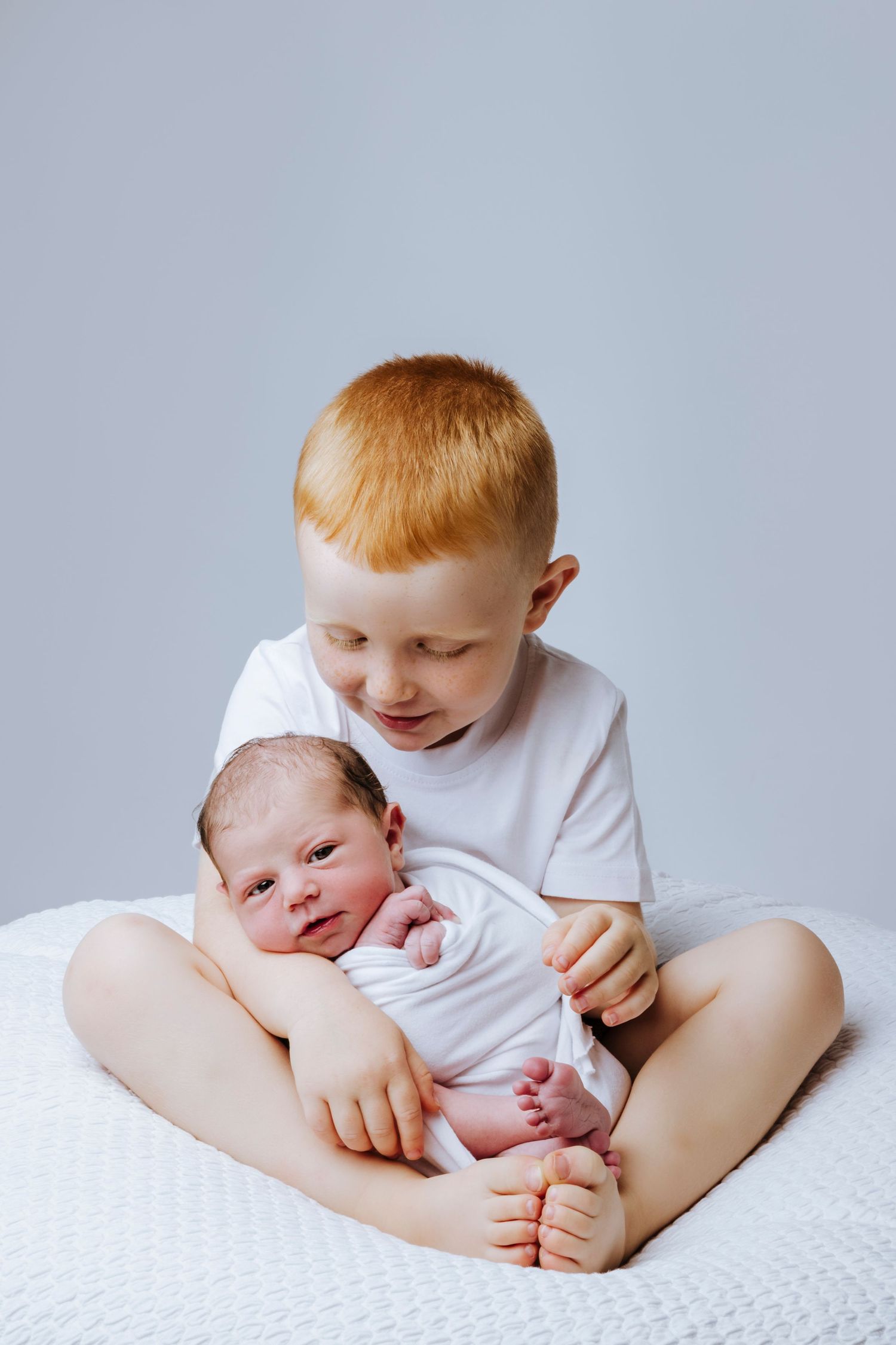 newborn and brother