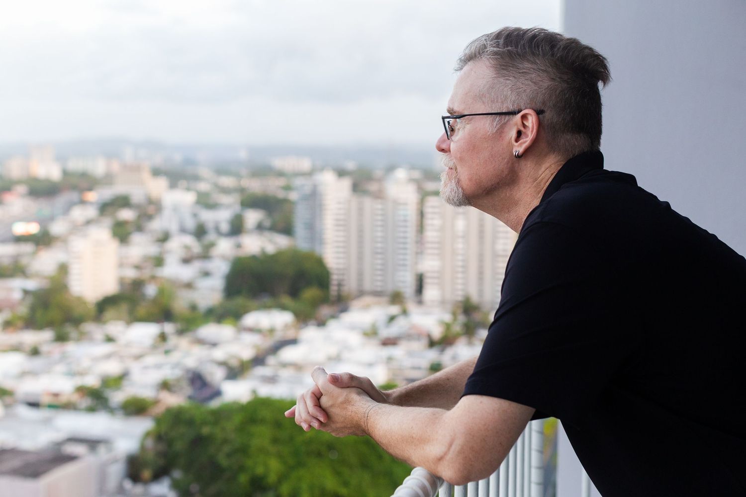 Portrait of a man on a condo balcony. Guaynabo, Puerto Rico.