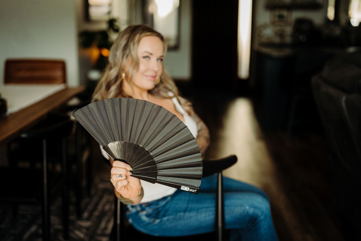Esthetician holds up fan during a Mini Branding Photoshoot