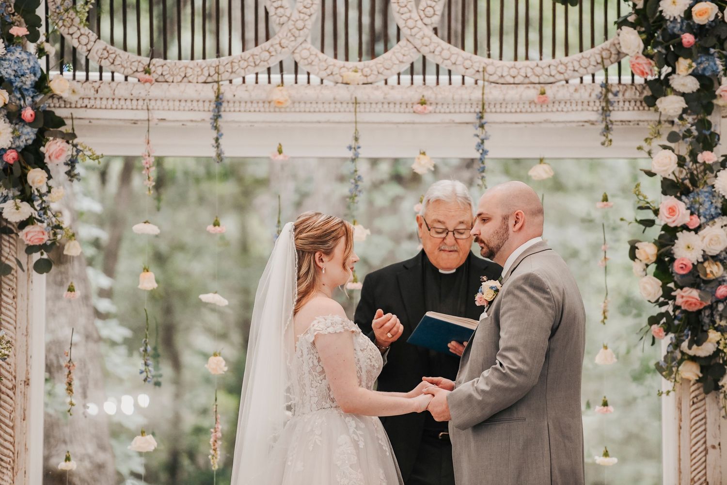 Romantic wedding vows inside the light-filled North Texas ceremony venue