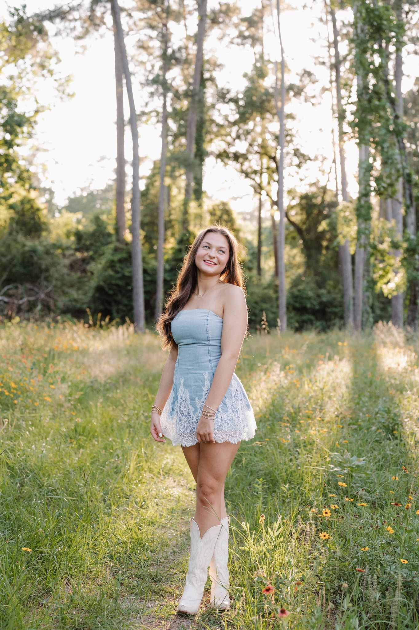 Oak Ridge senior girl posing in a meadow in The Woodlands Texas