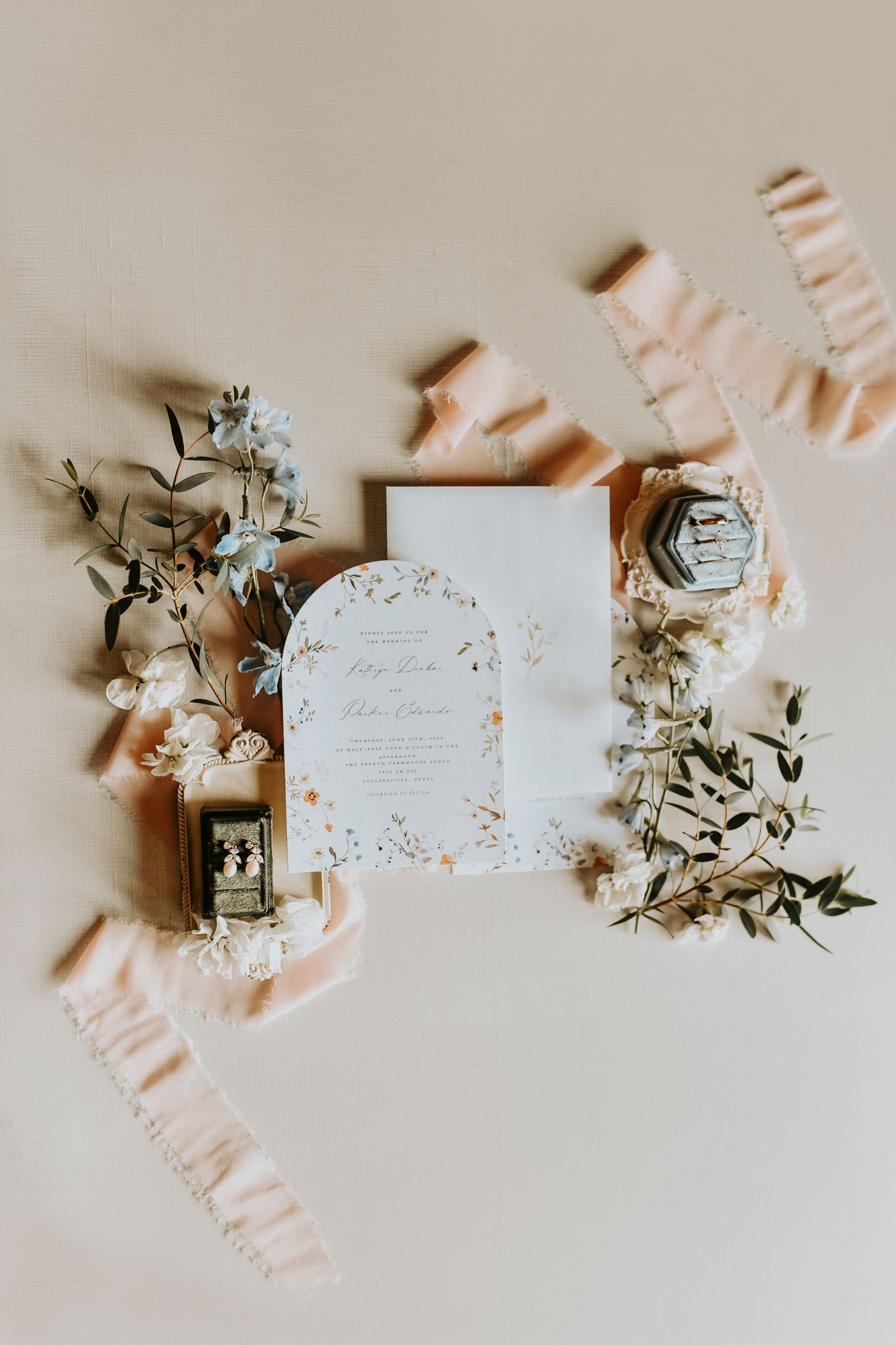 Wedding invitation suite styled with pastel flowers for a French Farmhouse wedding