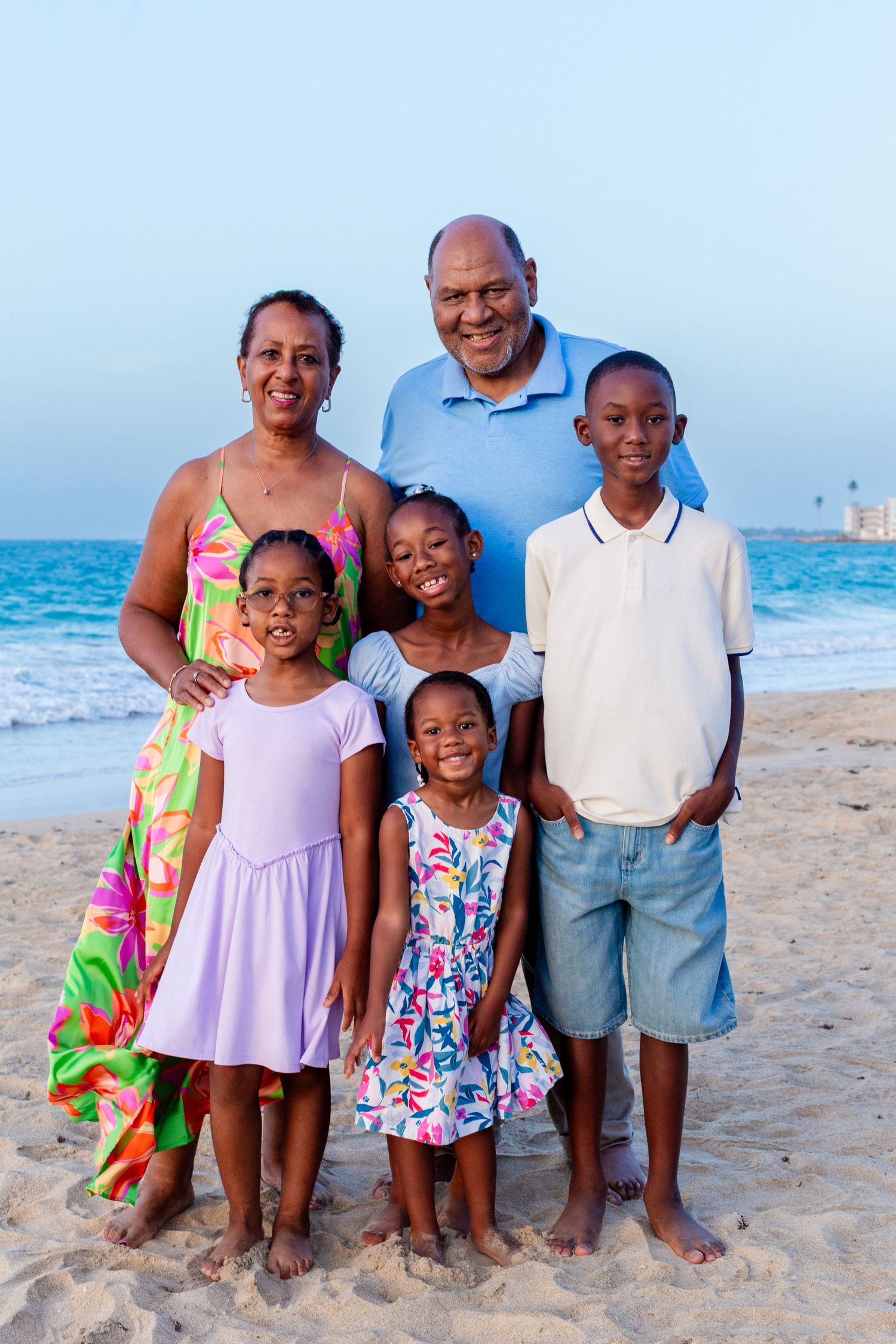 Family portrait. Grandparents and four grandkids on the beach in Isla Verde, Carolina, Puerto Rico.