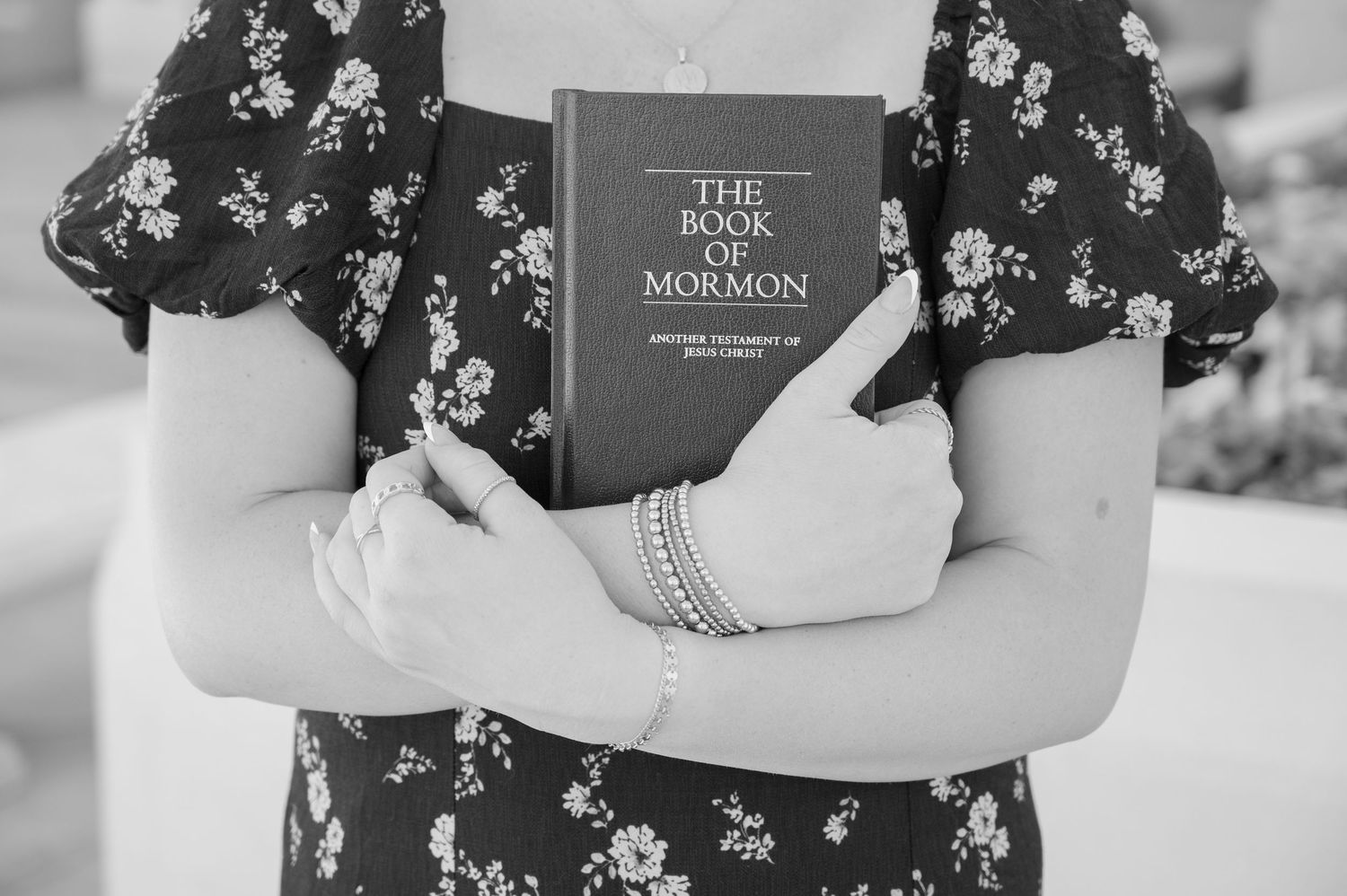 Book of mormon in girls hands