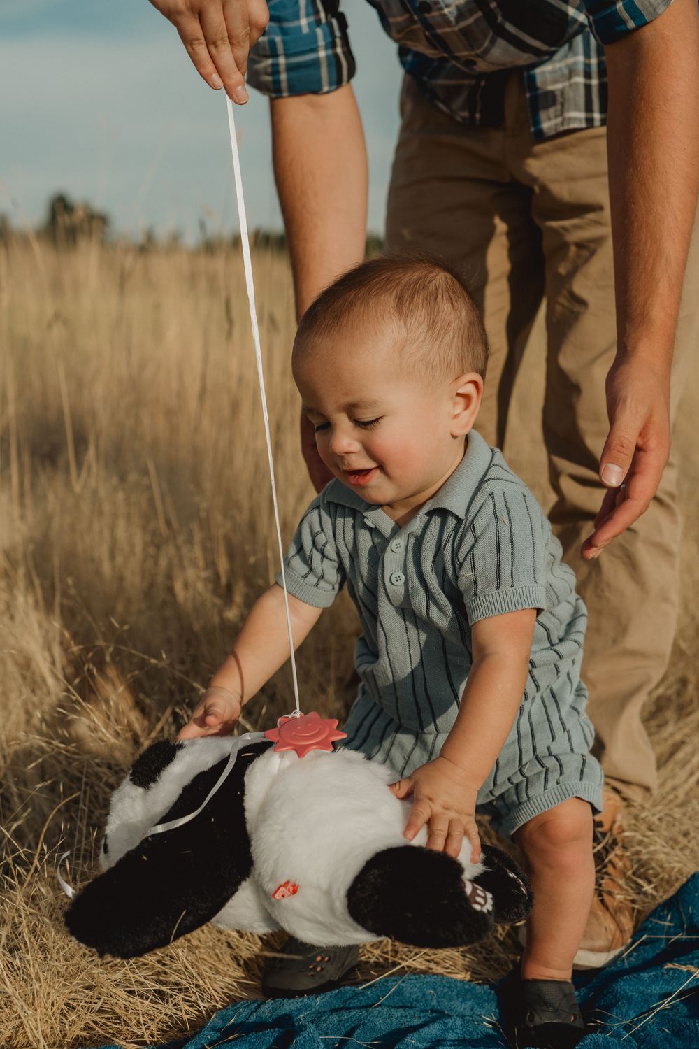Candid portrait of a one-year-old baby during a first birthday session at the WSU Arboretum in Pullman, WA.