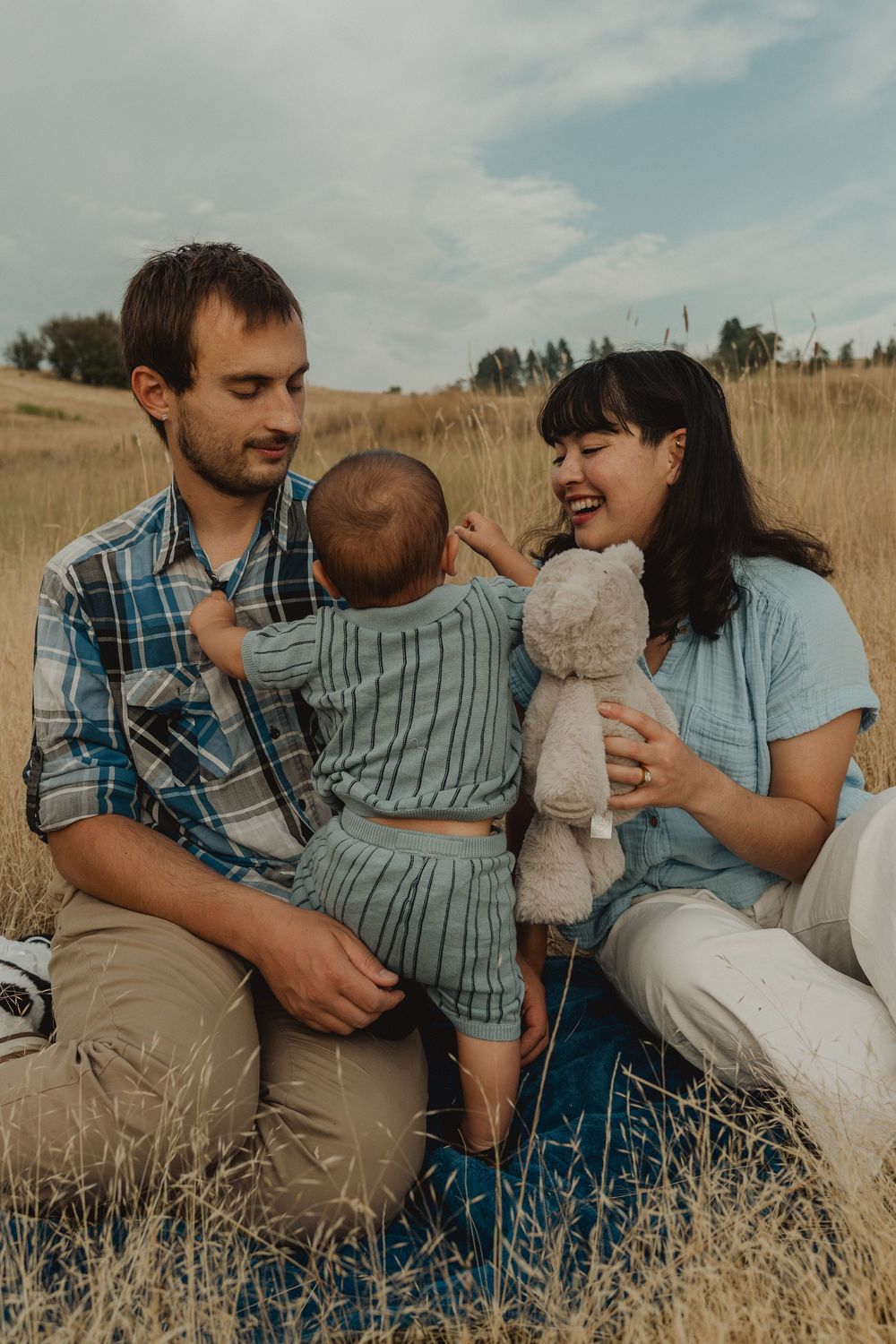 Candid family photography capturing natural moments during a first birthday session.