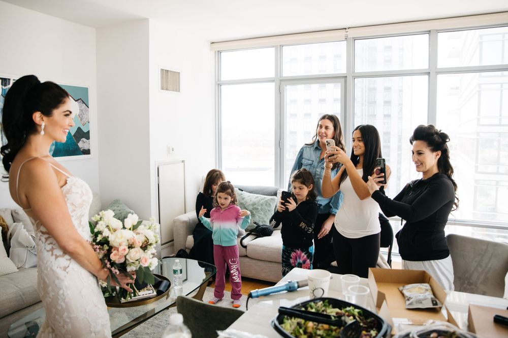 Candid moment of celebration and preparation in a bright modern apartment.