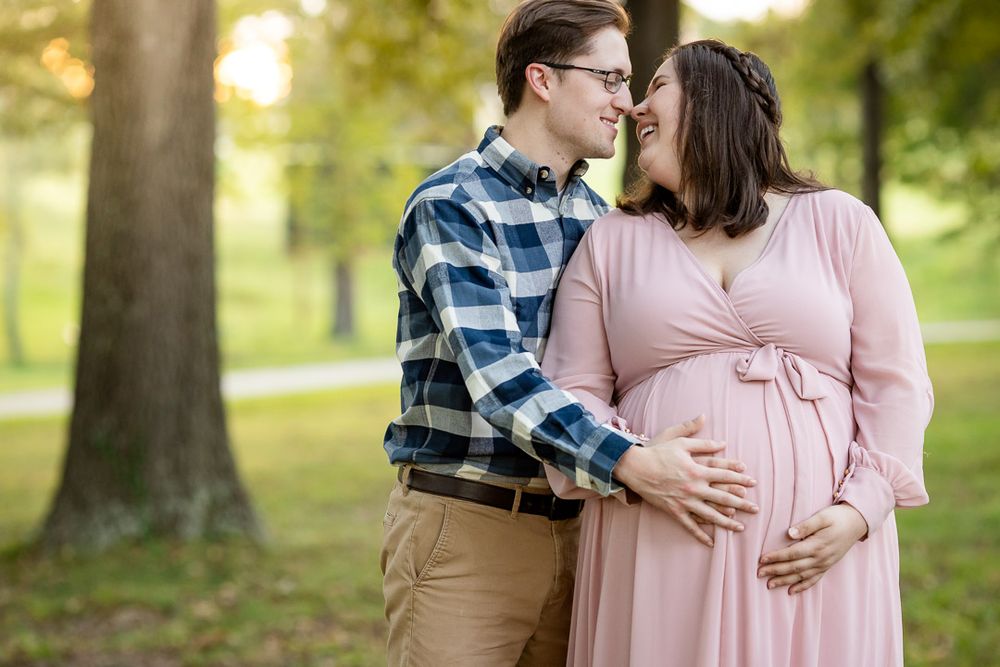 Expectant couple in a park during a maternity session in Mountain Home, Arkansas
